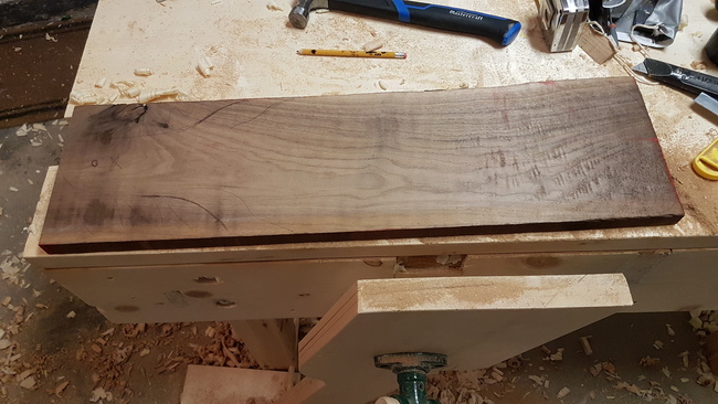 walnut board that will be turned into a charcuterie board. Shows milling imperfections.
